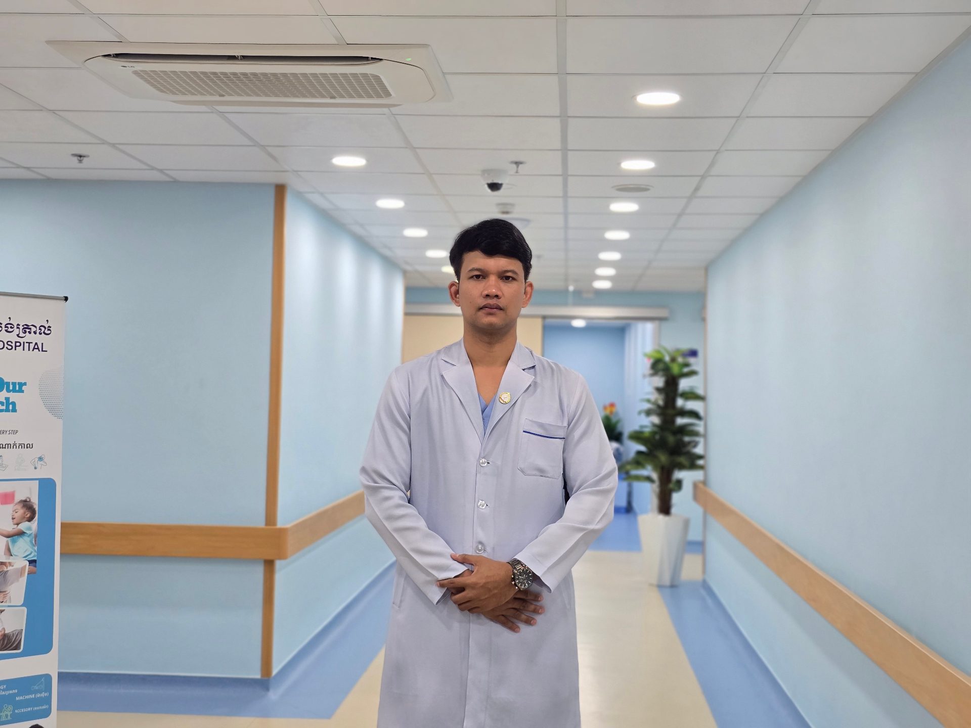Tree of Life staff member standing in a modern care facility